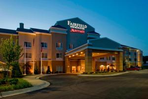 a hotel with a sign on the front of it at Fairfield Inn & Suites Columbus in Columbus