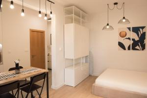 A bed or beds in a room at Top Center Designer Studio Apartment