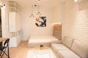A seating area at Top Center Designer Studio Apartment