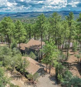 an aerial view of a house in the woods at Mountain Cabin Retreat in the Pines in Prescott