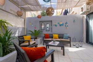 a lobby with couches and a table and plants at Ezgi's Apartment with Private Garden in Marmaris in Marmaris
