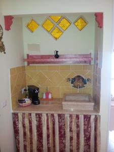 A kitchen or kitchenette at Olimpo Palace Affittacamere