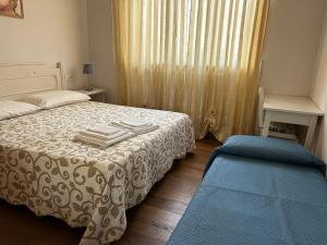 Säng eller sängar i ett rum på Casa vacanze Diana