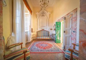 Postel nebo postele na pokoji v ubytování Palazzo Ronchelli