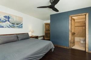 a bedroom with a bed and a ceiling fan at 725 E College Unit 8 in Durango