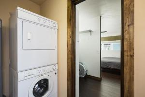 a washer and dryer in a room with a bedroom at 725 E College Unit 8 in Durango