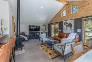 a living room with a couch and a fireplace at 3076 W Highway 160 - Guest House in Mancos