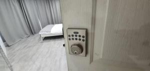 a door to a room with a bed in a bedroom at Dana-Spacious Private Room in Shared 2-Bedroom Apartment-2 in Canberra