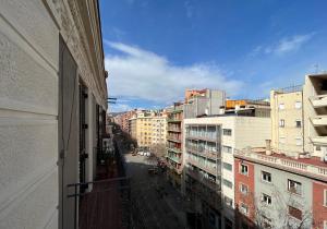 a view of a city street from a balcony at Stay U-nique Apartments Calabria in Barcelona