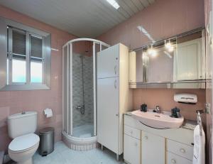 Koupelna v ubytování Stay U-nique Apartments Calabria + 12 fotografií