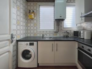 Kuchyň nebo kuchyňský kout v ubytování Stay U-nique Apartments Calabria