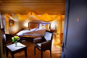 Postel nebo postele na pokoji v ubytování Griesalp Hotels