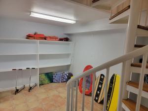 a room with skis and snowboards on a staircase at Paradise lagoon*bayhouse fishing*beach*Dogfriendly in Galveston