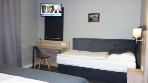 Łóżko lub łóżka w pokoju w obiekcie Pension Falconi