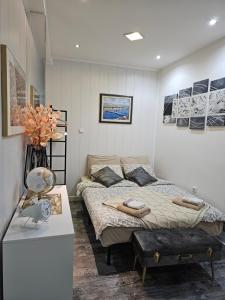 a bedroom with a bed and a table in it at Old Town Center Zadar in Zadar