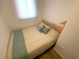 Łóżko lub łóżka w pokoju w obiekcie Apartamento La Merced