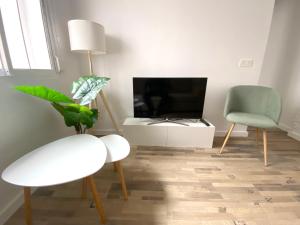 Telewizja i/lub zestaw kina domowego w obiekcie Apartamento La Merced