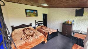 Postel nebo postele na pokoji v ubytování Hospedaje campestre los pinos