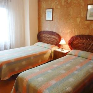 Postel nebo postele na pokoji v ubytování Casa Quini