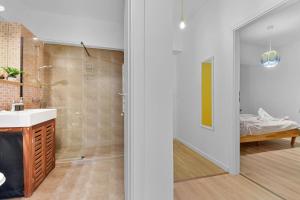 a bathroom with a sink and a shower at Asteri Garden & Terrace Apartment in Sinaia +15 photos
