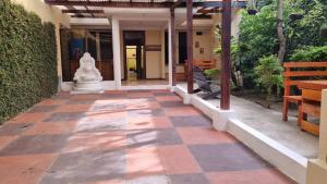 a walkway leading to the entrance of a building at AZURA HOTEL BOUTIQUE in Cobán