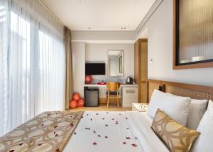 a hotel room with a bed and a kitchen at Galata Rasso Hotel in Istanbul