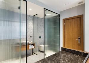 a bathroom with a glass shower and a toilet at Galata Rasso Hotel in Istanbul +27 photos