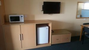 Kuchyň nebo kuchyňský kout v ubytování Annerley Motor Inn