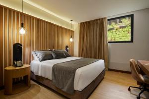 Postel nebo postele na pokoji v ubytování Blues Suites Medellín