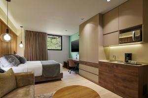 Postel nebo postele na pokoji v ubytování Blues Suites Medellín