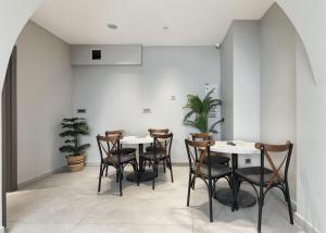 a dining room with two tables and chairs at Galata Rasso Hotel in Istanbul