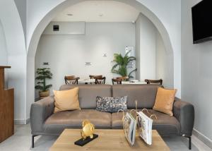 a living room with a couch and a table at Galata Rasso Hotel in Istanbul