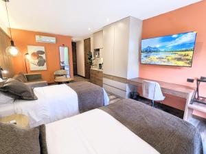 Postel nebo postele na pokoji v ubytování Blues Suites Medellín