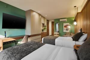 TV a/nebo společenská místnost v ubytování Blues Suites Medellín