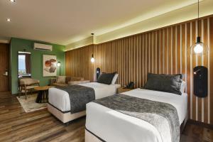 Postel nebo postele na pokoji v ubytování Blues Suites Medellín