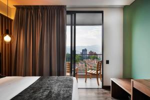Postel nebo postele na pokoji v ubytování Blues Suites Medellín