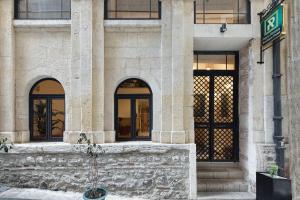 a building with windows and a fountain in front of it at Pera Rasso Hotel in Istanbul