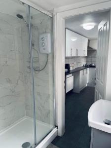 a bathroom with a shower and a sink at Railway House - By EazyStays in Crewe