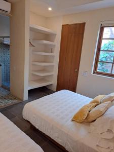 Postel nebo postele na pokoji v ubytování La Casa del Totumo