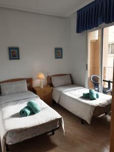 Postel nebo postele na pokoji v ubytování Nice holidays apartment in Torreveja,