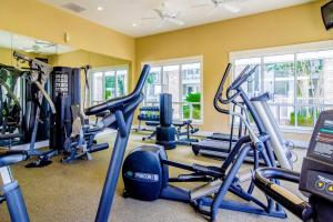 a gym with several treadmills and exercise bikes at Baytowne Wharf - Observation Point North #460 in Destin