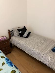 a bed with two pillows on it in a room at 004- Brand new 1 bedroom apartment F1 in Ealing