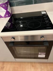 a stove top oven sitting in a kitchen at 004- Brand new 1 bedroom apartment F1 in Ealing
