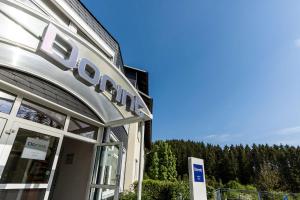 a scientology building with a sign in front of it at Dorint Parkhotel Siegen in Siegen