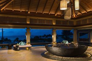 a lobby with a large tub in the middle of a building at Phuket Marriott Resort and Spa, Nai Yang Beach in Nai Yang Beach