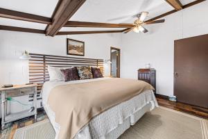 a bedroom with a bed and a ceiling fan at Eagle's Nest in Franklin