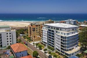 an aerial view of a city and the beach at Sandy Cove Apartment The Entrance 17 in The Entrance