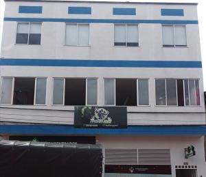 a building with a sign on the side of it at Apartamentos LM in Santa Rosa de Cabal