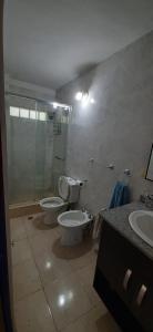a bathroom with a toilet and a shower and a sink at Apart Hotel Red Dto 1 in Pontevedra
