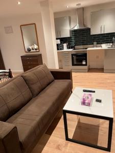 a living room with a couch and a coffee table at 021- Two bedrooms in Ealing 2 in Ealing